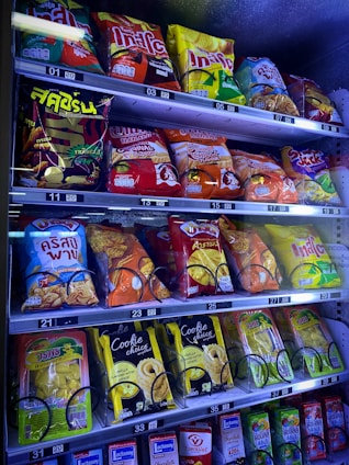 A friendly vending machine stocked with colorful, wholesome snacks in a hospital lobby.