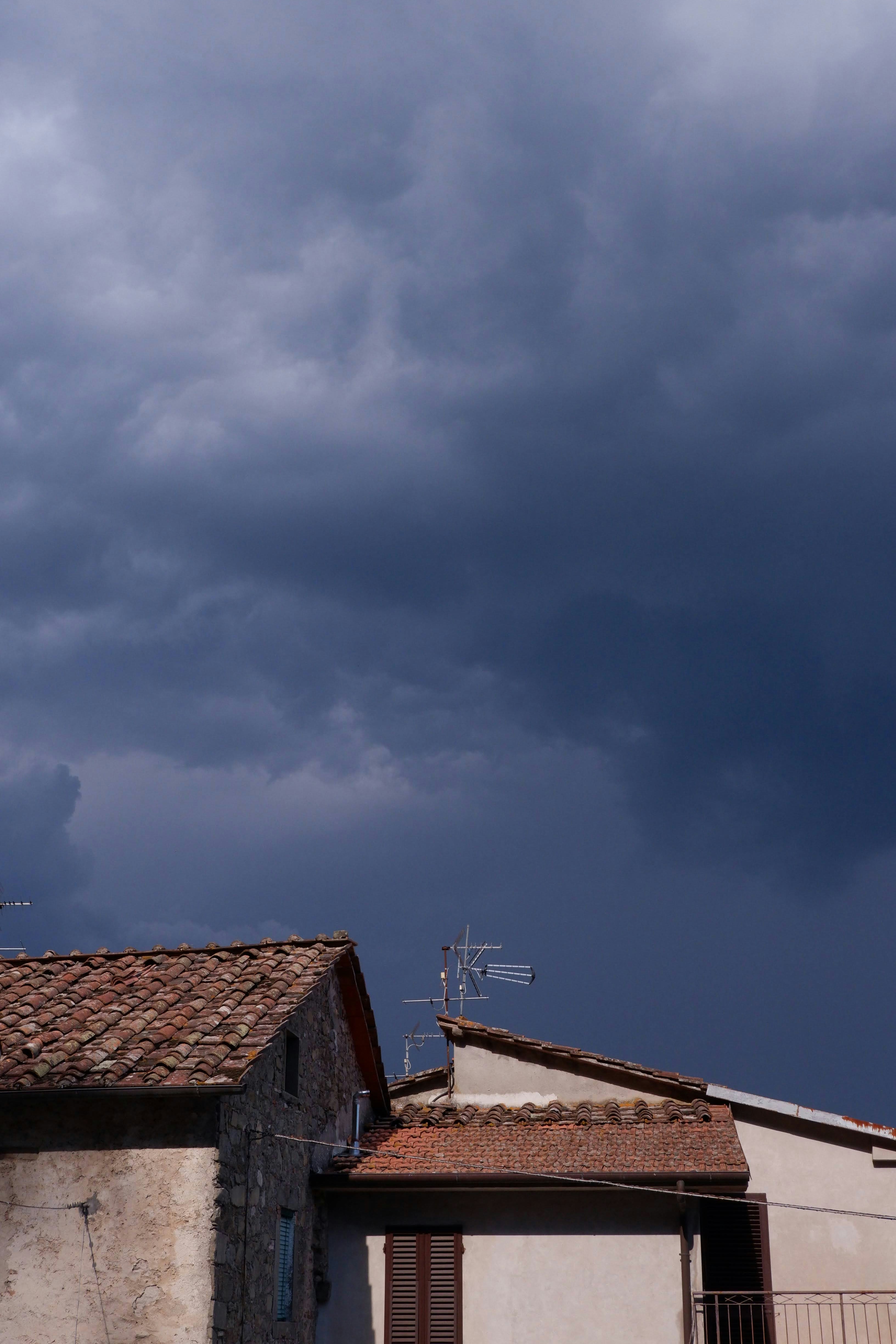 a building with a weather vane on top of it