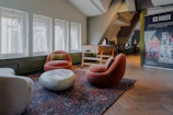 Cozy lounge area with comfy seating and vibrant decor where players relax between matches