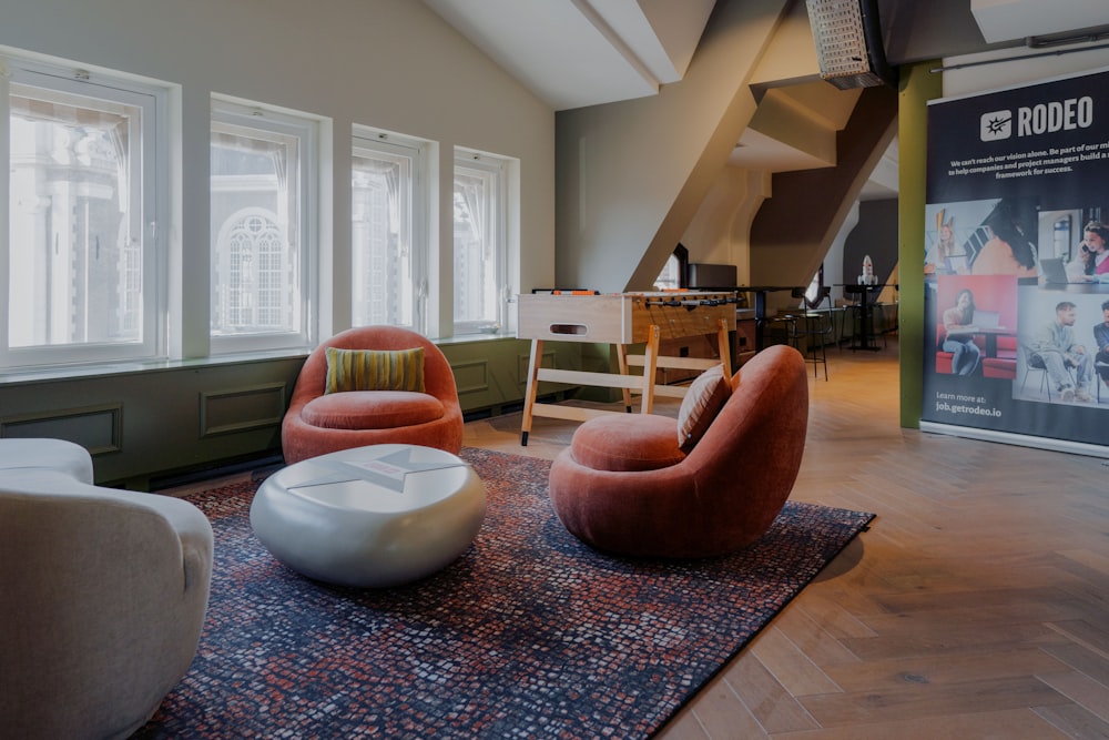 a living room filled with furniture and windows