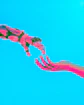 robot and human hands reaching toward each other