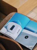 an open book with a picture of a white building