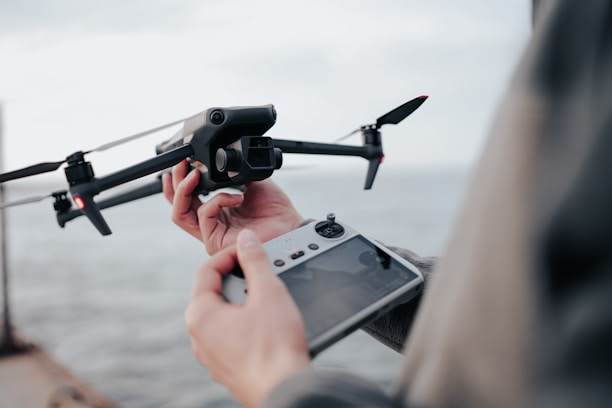 Indian defence drone pilot operating a training drone in a controlled environment.