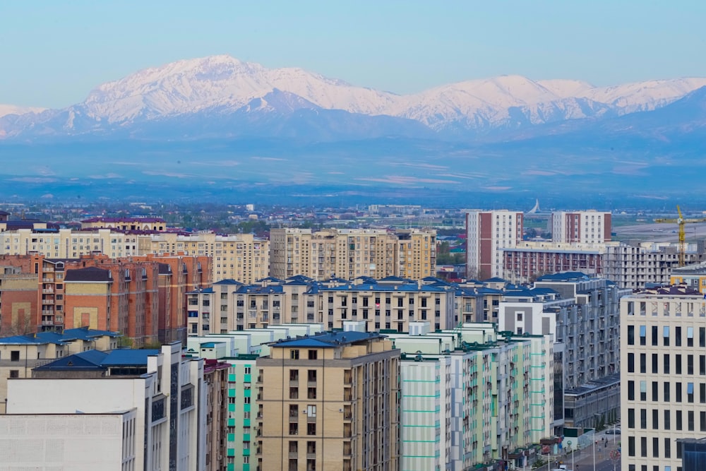 a view of a city with mountains in the background