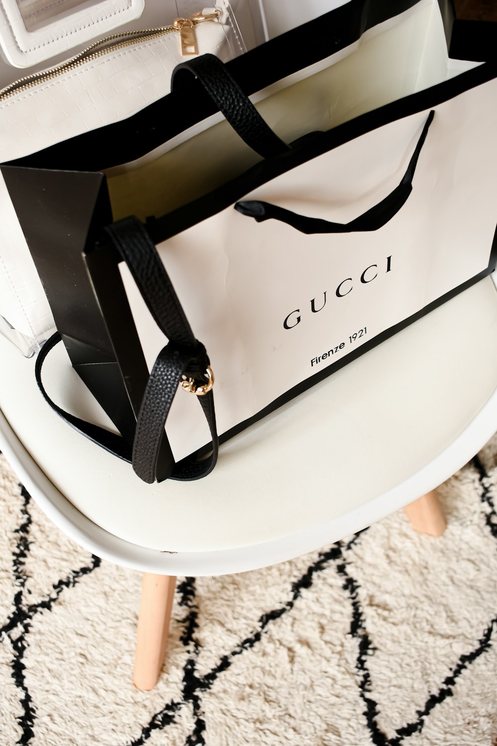 a white bag sitting on top of a white table