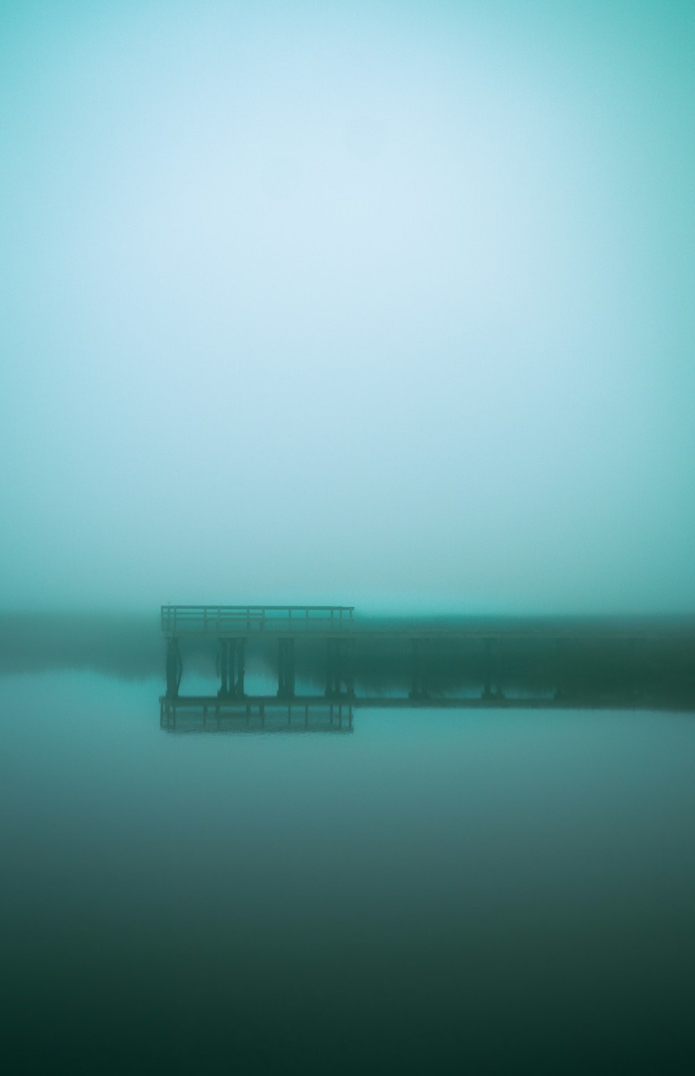 a pier in the middle of a body of water
