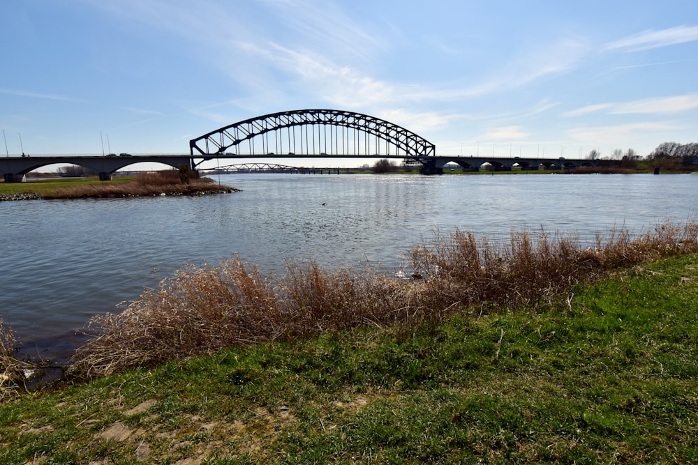 a bridge over a body of water on a sunny day