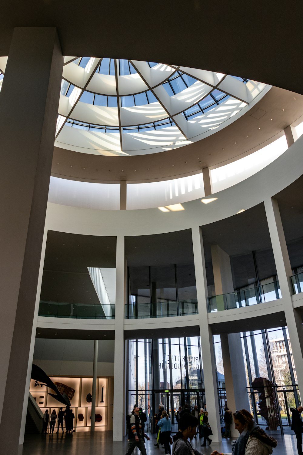 a group of people standing inside of a building