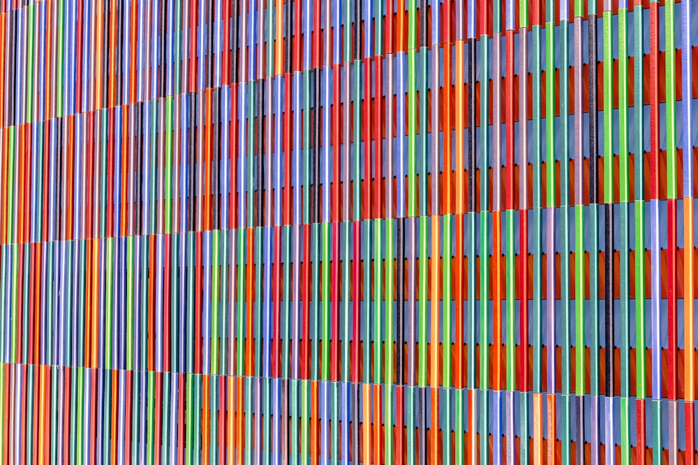a multicolored wall is shown with vertical lines