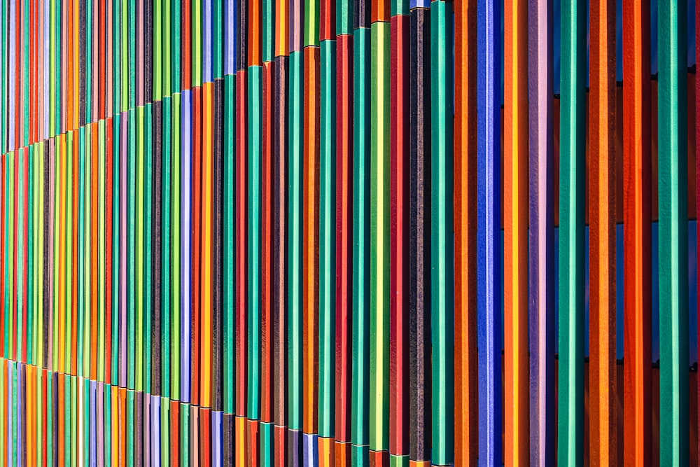 a multicolored wall with many different colored bars on it