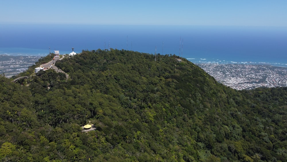 a view of a mountain with a cell phone tower on top of it