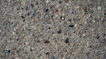 a close up of rocks and gravel on a surface