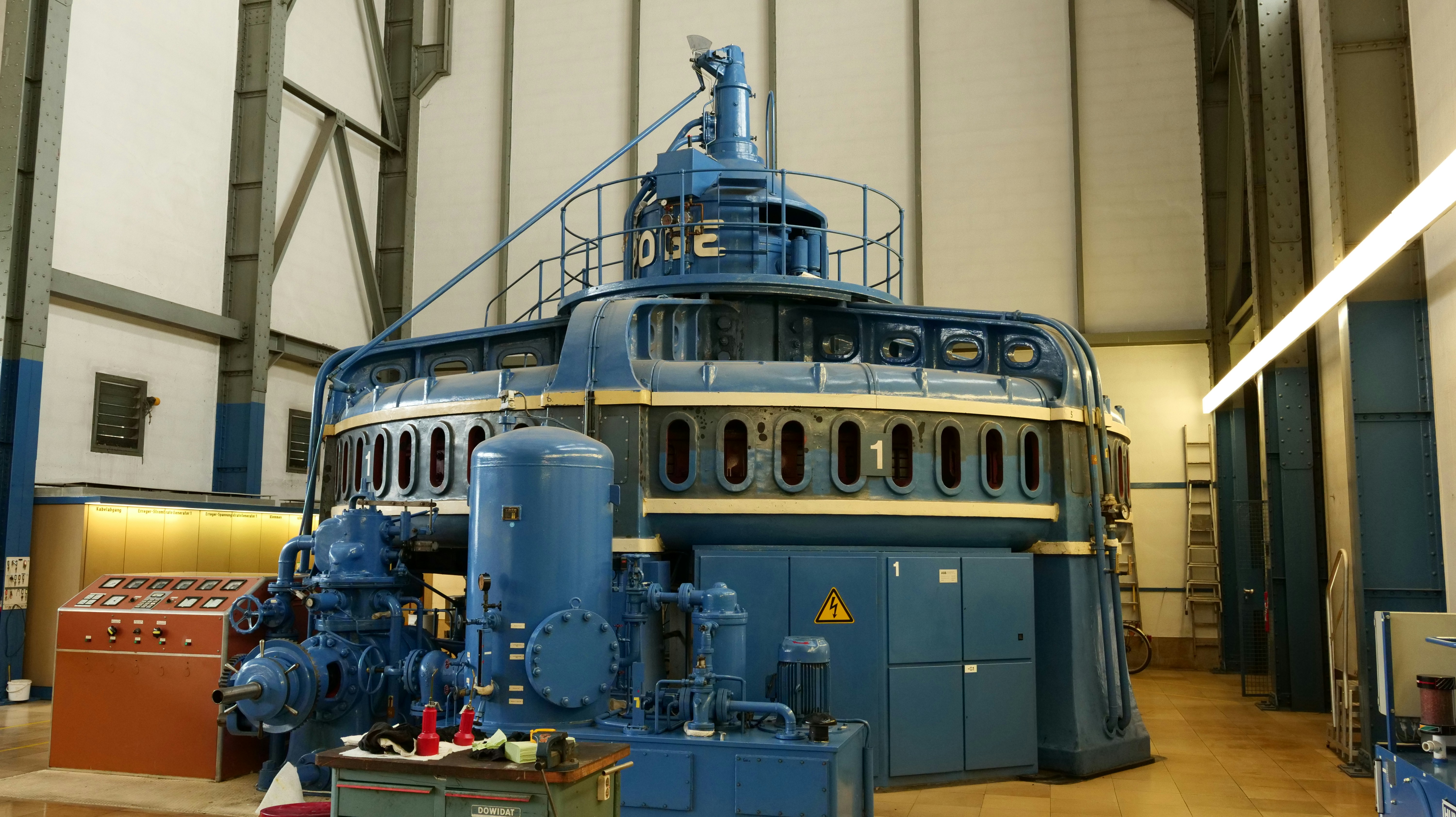 a large blue machine in a large building