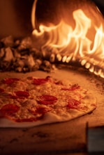 a pizza sitting on top of a pizza stone