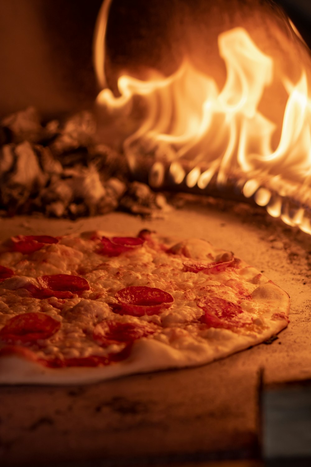 a pizza sitting on top of a pizza stone