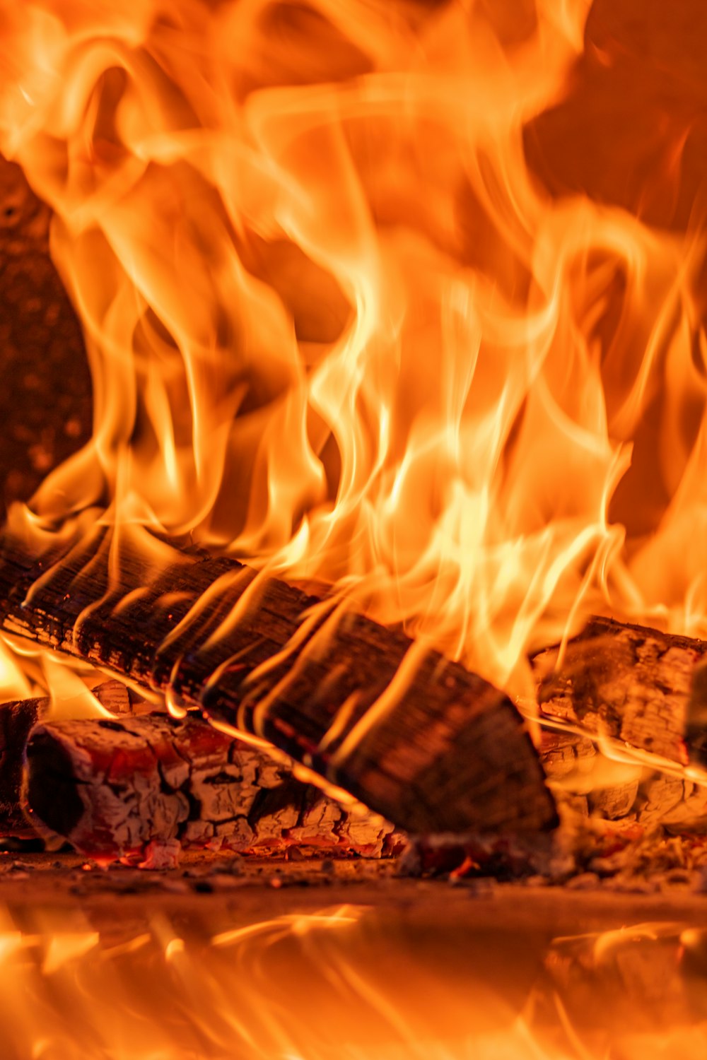 a close up of a fire burning in a fireplace