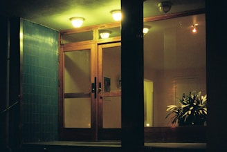 A cozy office entrance with a blue dark background and a welcoming sign of Dua Putra business.