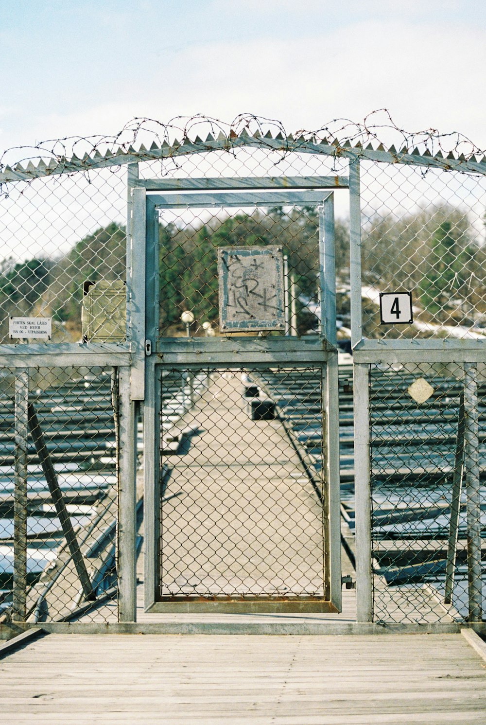 a gate that has a clock on top of it