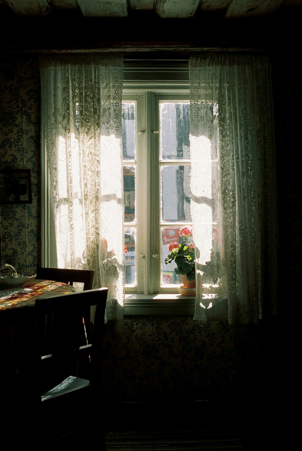 a room with a table and a window