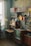 A cozy living room featuring vintage decor items like an old clock and retro furniture.