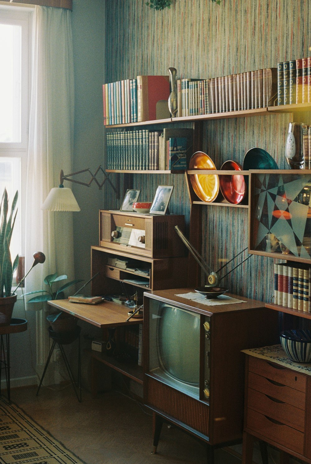 a living room filled with furniture and a window