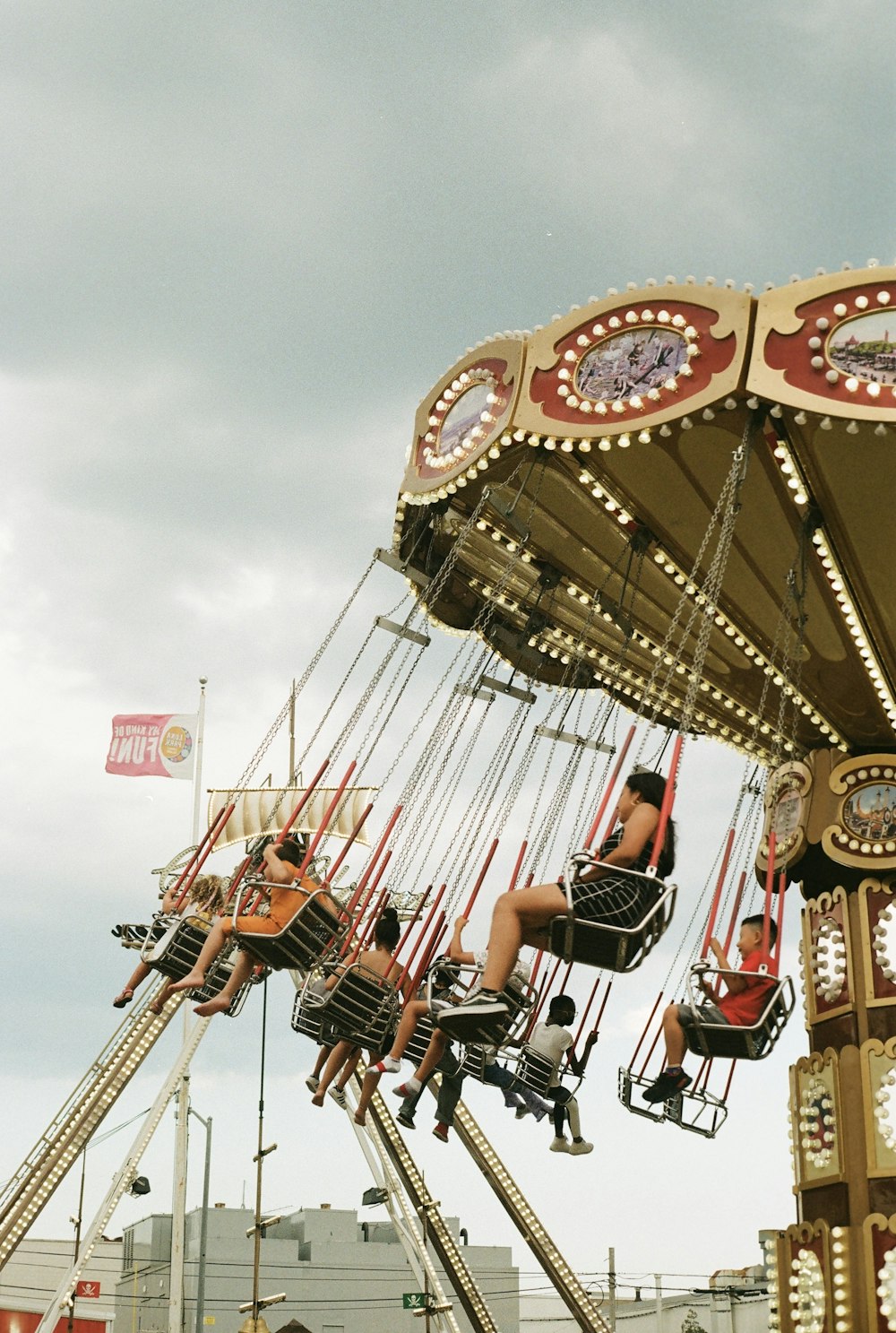 a group of people riding on a carnival ride