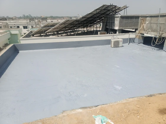 Technician inspecting a commercial rooftop solar array with thermal camera in NYC skyline background.