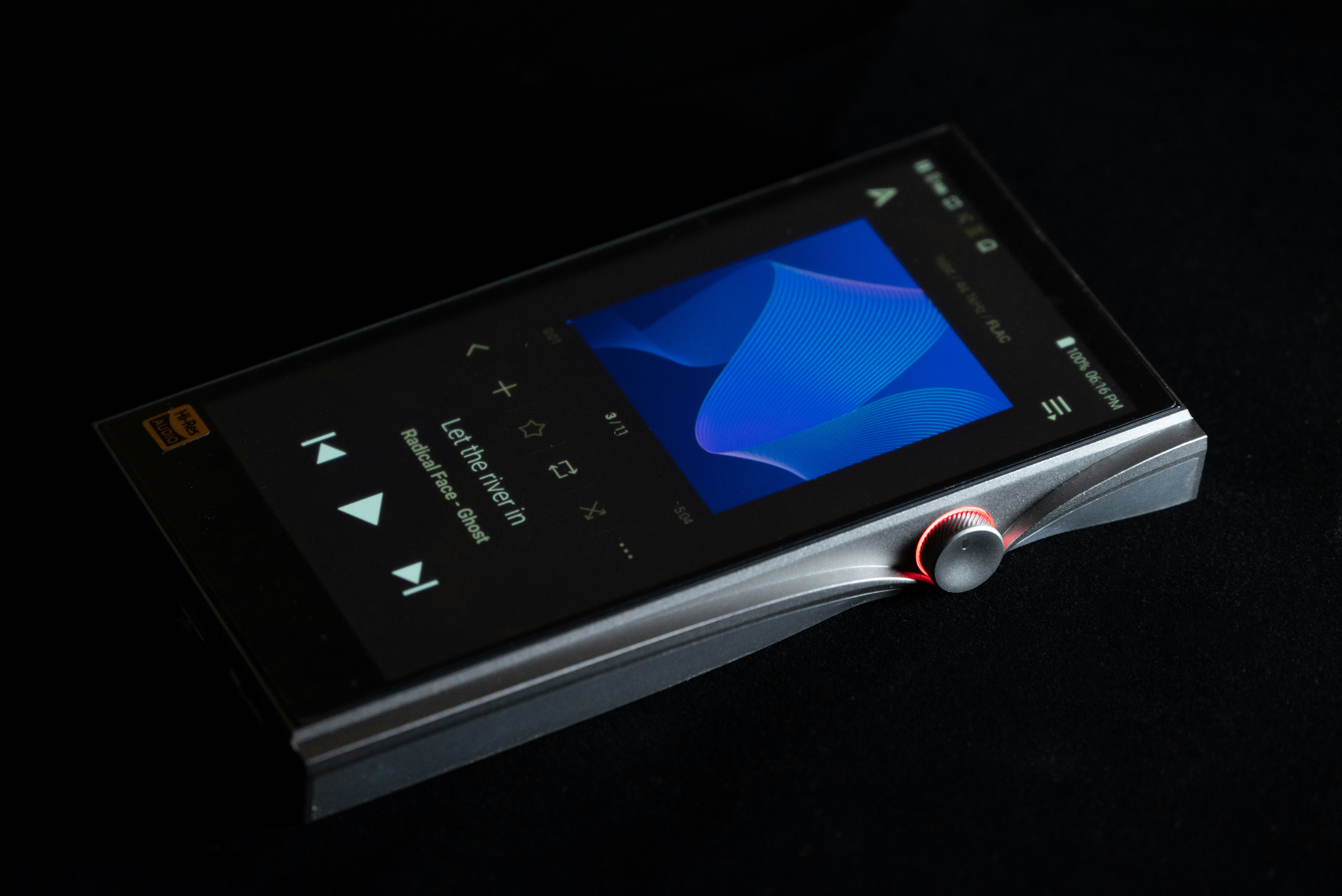 Technician using a tablet to review battery health diagnostics for an electric vehicle