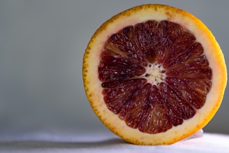 Close-up of vibrant blood oranges sliced open to reveal deep red flesh.