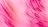A close-up of a vibrant paintbrush stroke on a textured canvas.