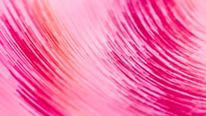 A close-up of swirling brushstrokes in a floral-inspired canvas.