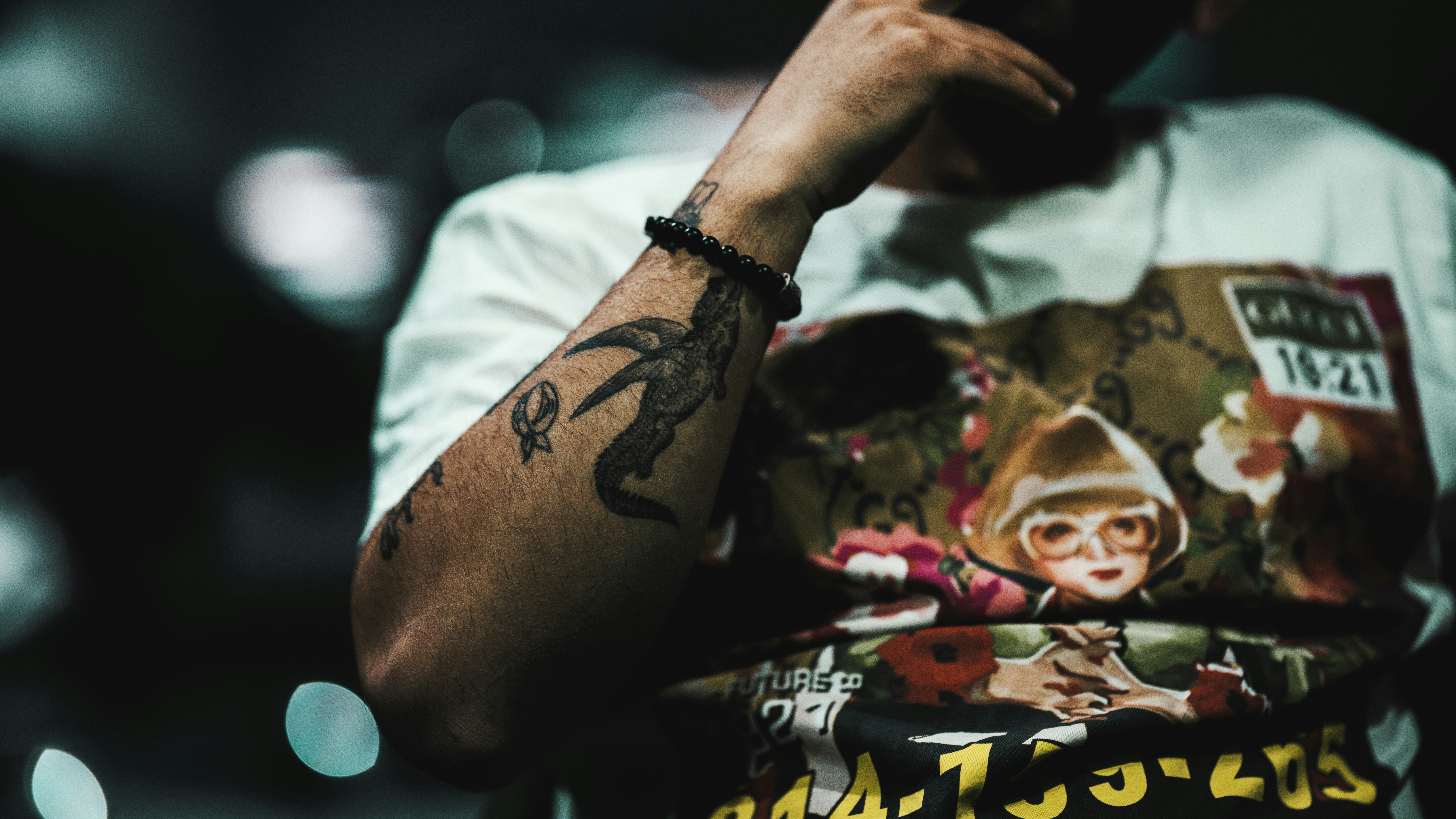 a man with a tattoo on his arm
