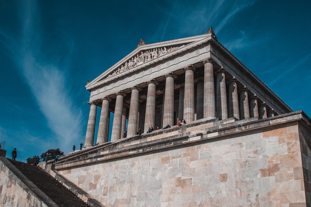 a large stone building with columns on top of it