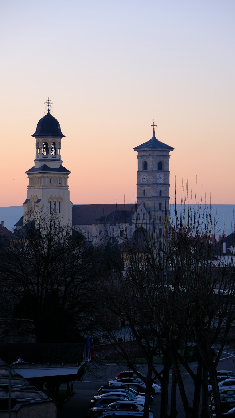 a large white clock tower towering over a city