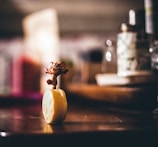 A close-up of a hand holding a lucky mouse figurine, symbolizing dreams and luck.