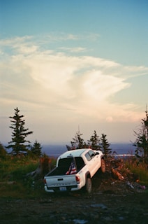 a white truck with an american flag on the back of it