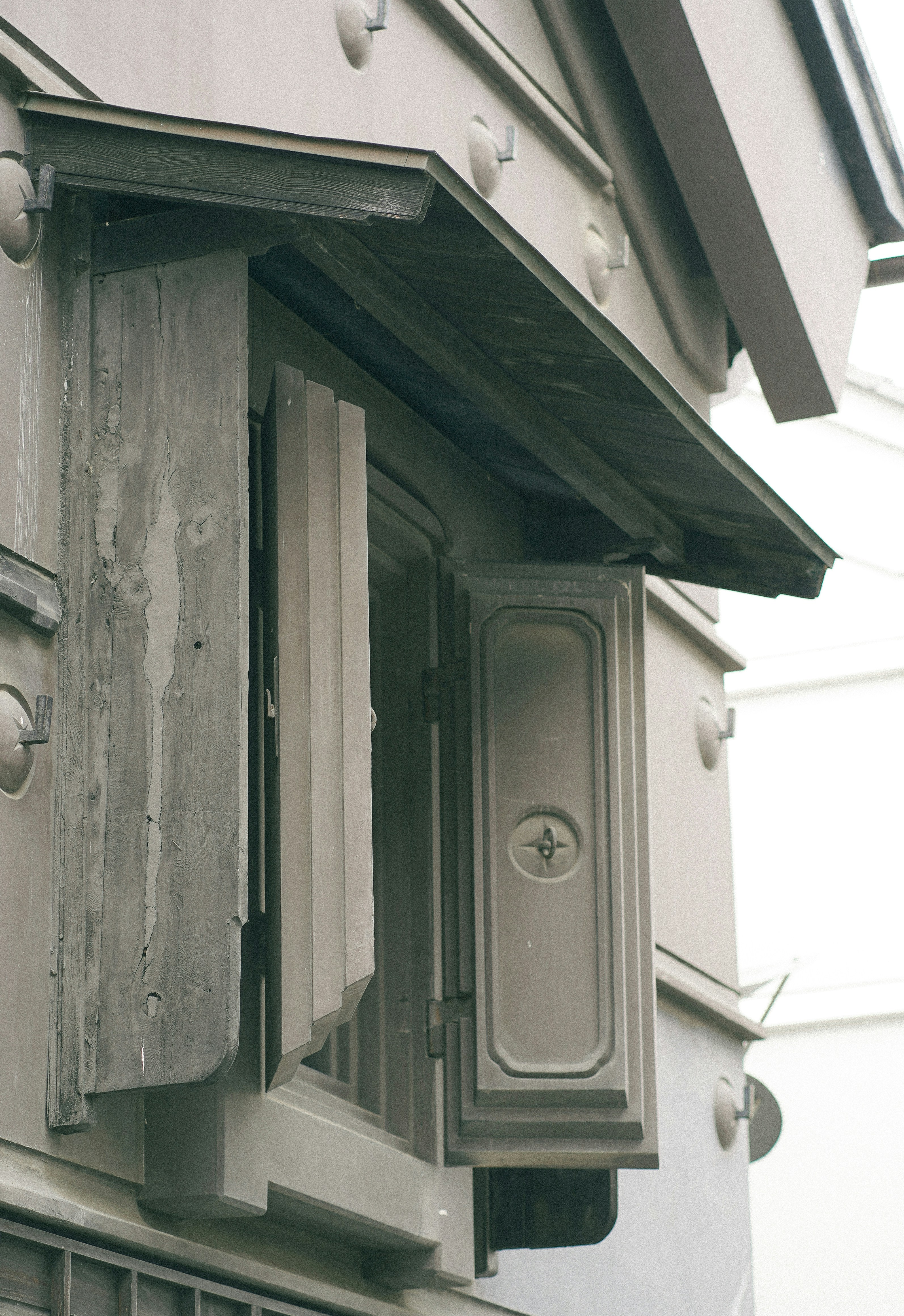 a close up of a bird house on a building