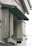 Close-up of a luxurious dark-toned louvered shutter highlighting its fine texture and craftsmanship.