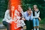a group of young women sitting next to each other