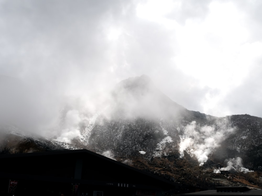 a view of a mountain with steam coming out of it