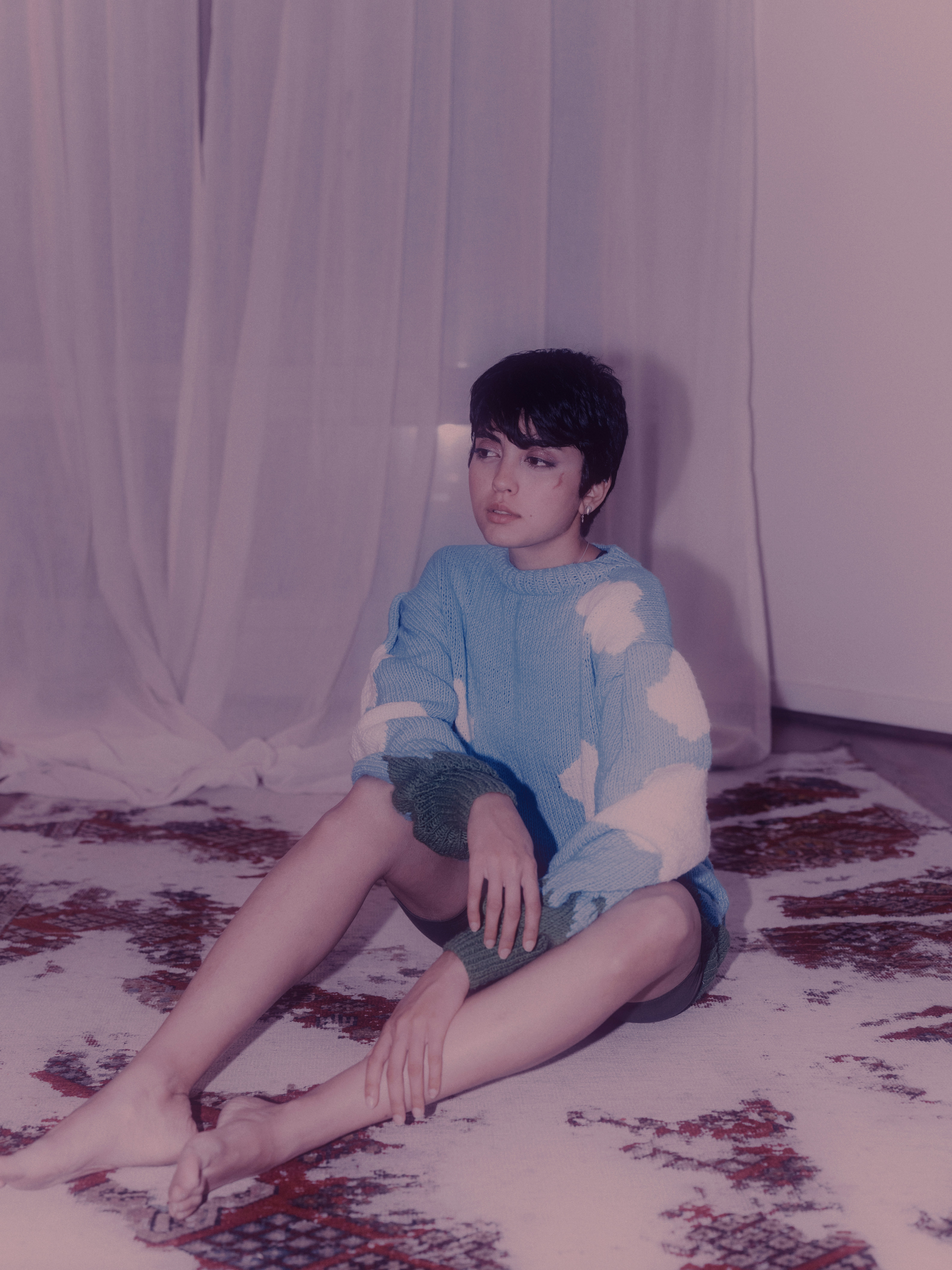 woman wearing yellow long-sleeved dress under white clouds and blue sky during daytime