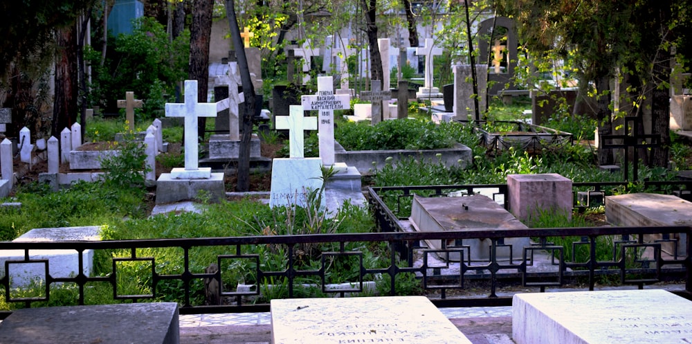 a cemetery filled with lots of tombstones and crosses