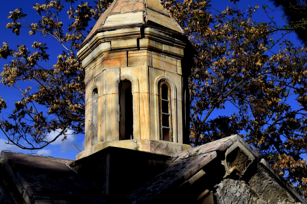 a tower with a clock on top of a building