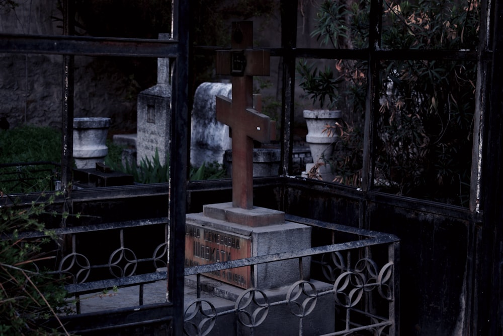 a cemetery with a cross in the middle of it