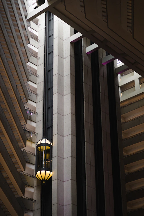 Sleek modern elevator shaft with minimalist design and soft lighting