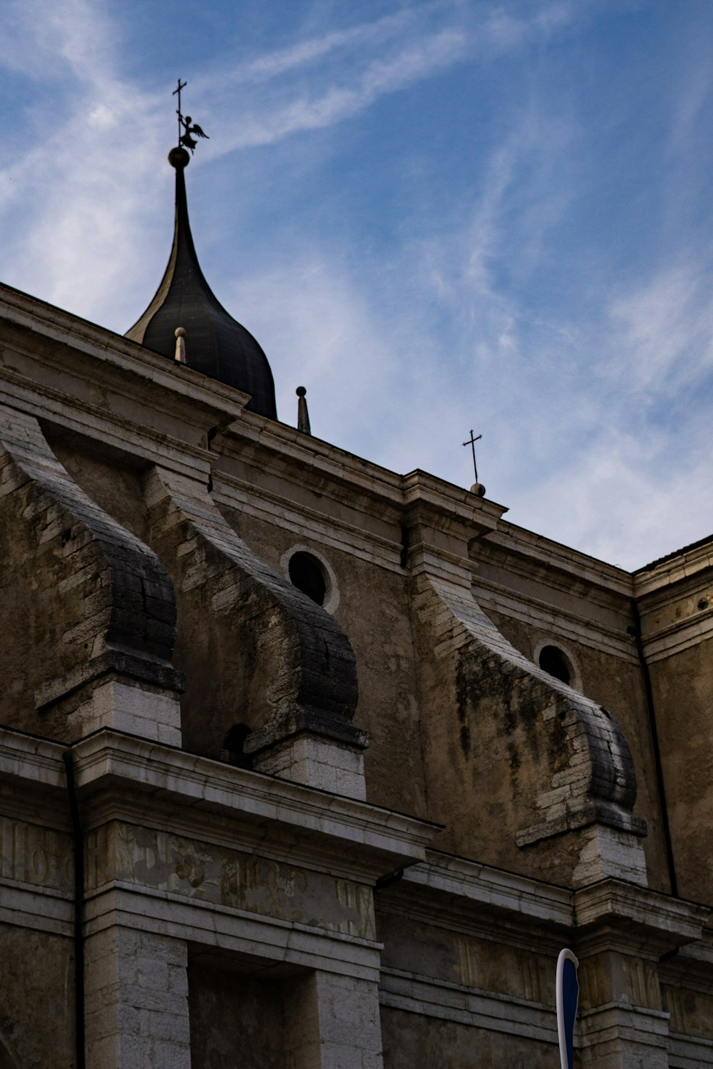 a church with a steeple and a cross on top