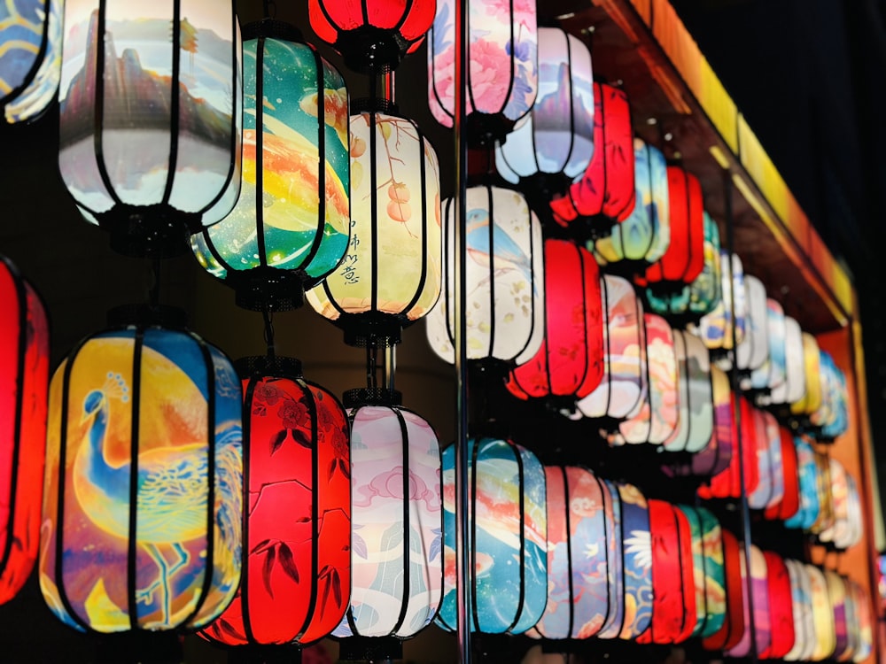 a bunch of colorful lights hanging from a wall