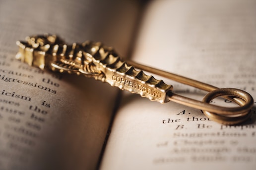 a golden key on top of an open book