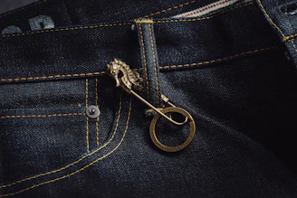 Close-up of a young woman wearing stylish, comfortable premium jeans with detailed stitching and a relaxed fit.
