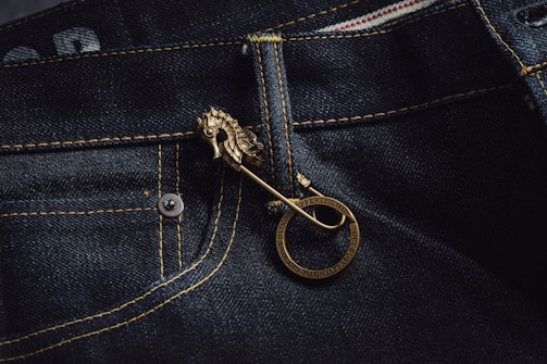 Elegant embroidered logo on a piece of denim showing fine craftsmanship and bright colors